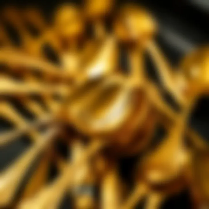 Close-up of intricate craftsmanship of gold espresso spoons