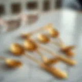 Elegantly arranged gold espresso spoons on a marble table