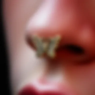 Butterfly Motif Details Close-up of a butterfly motif in body jewelry