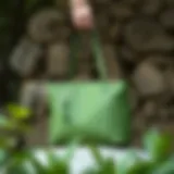 Stylish green bag displayed against a natural backdrop
