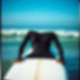 Stylish two-piece rash guard on a surfboard