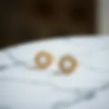 Elegant minimalist earrings displayed on a marble surface