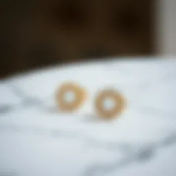 Elegant minimalist earrings displayed on a marble surface