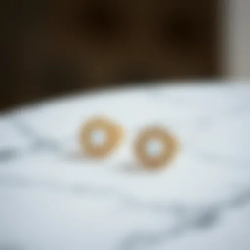 Elegant minimalist earrings displayed on a marble surface