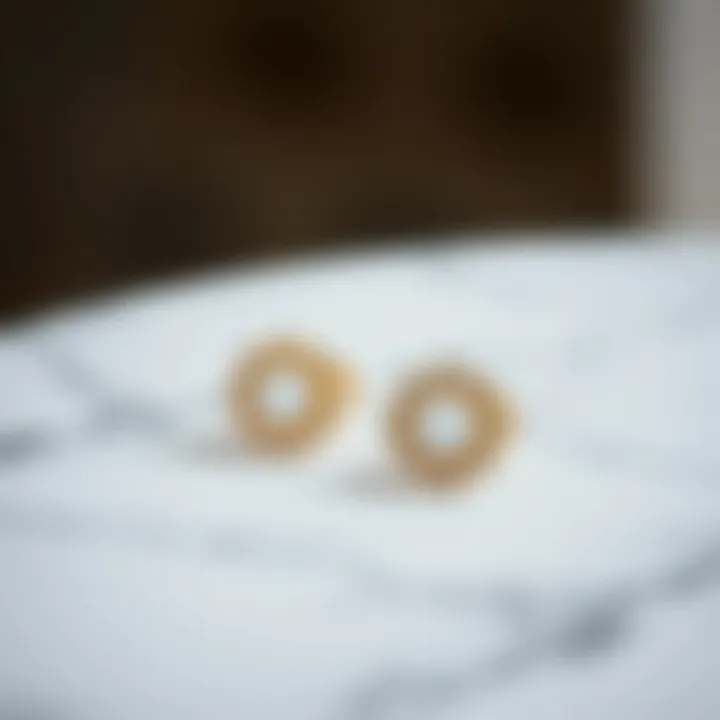 Elegant minimalist earrings displayed on a marble surface