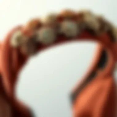 A close-up of a luxurious headband, illustrating the textures and materials that bridge past and present styles.