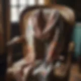 An elegant floral scarf elegantly draped over a vintage chair.