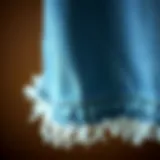 Detail of Frayed Hem on Denim A close-up of frayed hem detail on denim