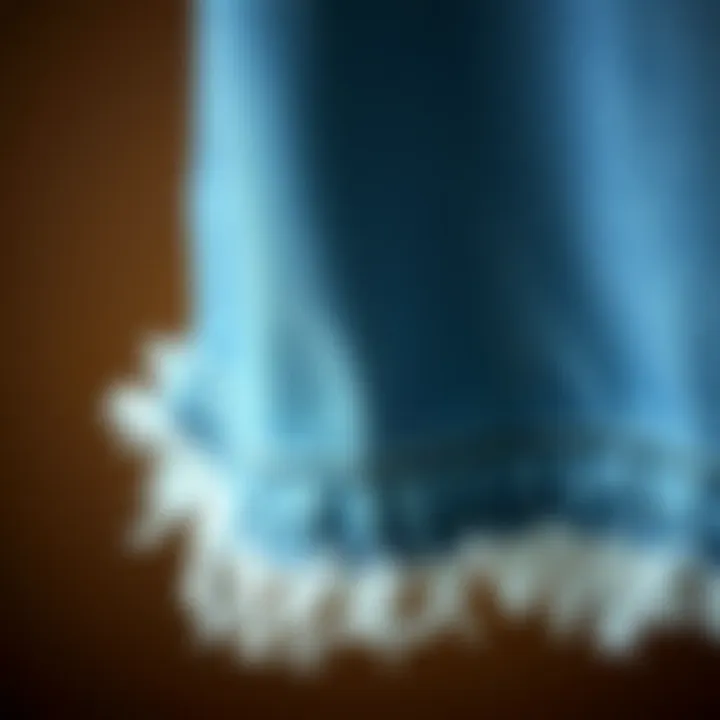 Detail of Frayed Hem on Denim A close-up of frayed hem detail on denim