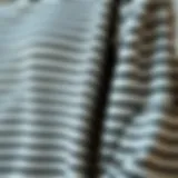 Textural Details of Striped Tee Close-up of a striped long sleeve tee showcasing fabric texture